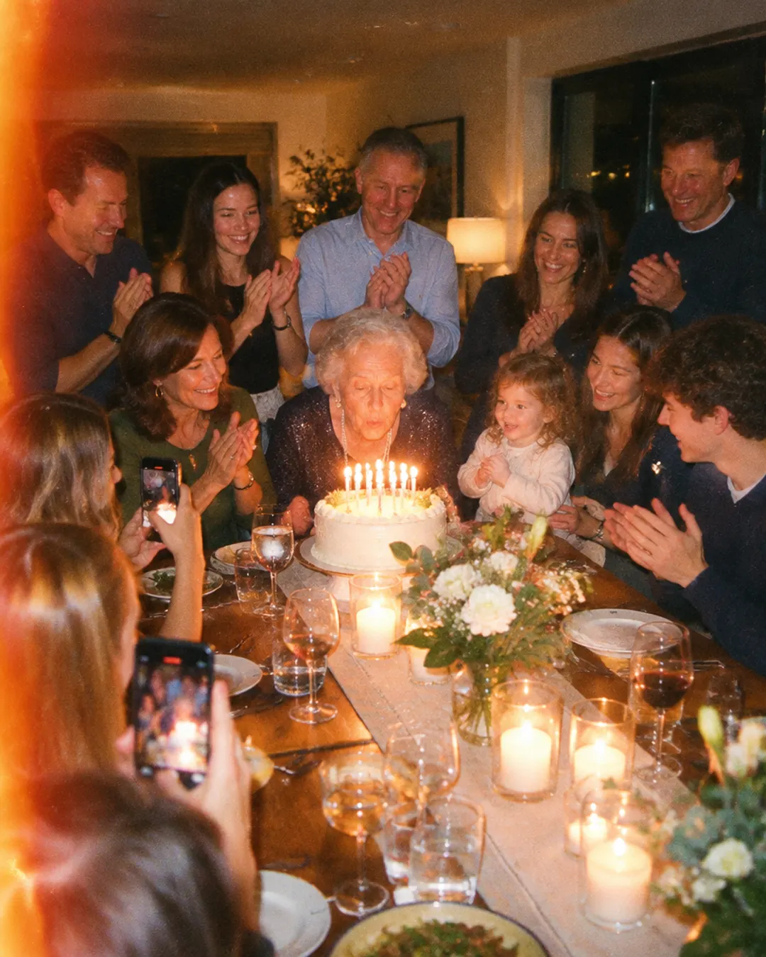 Family celebrating a grandmother's 80th birthday