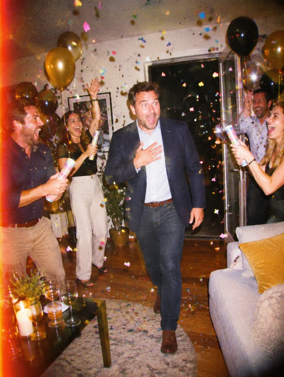 Friends shouting surprise at a 40th birthday