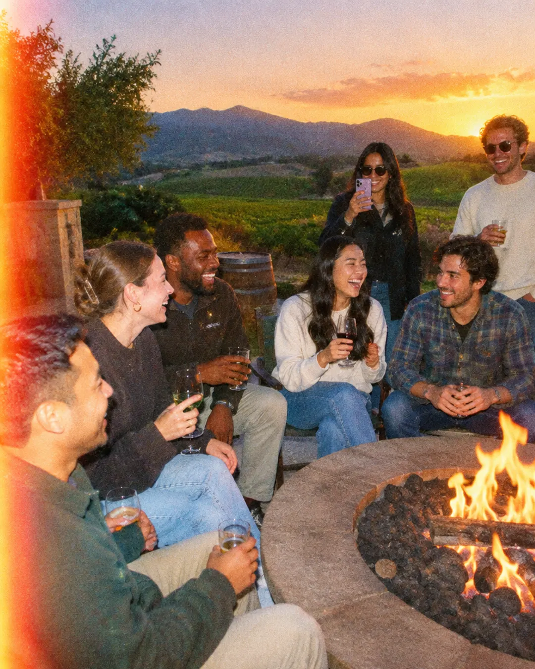 Team around a fire pit at a company offsite