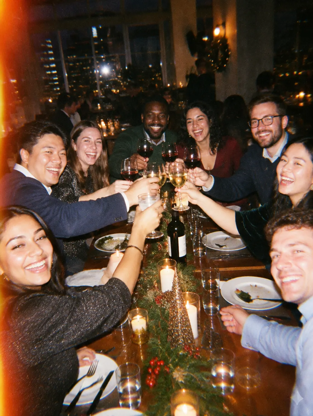 Team toasting at a holiday dinner