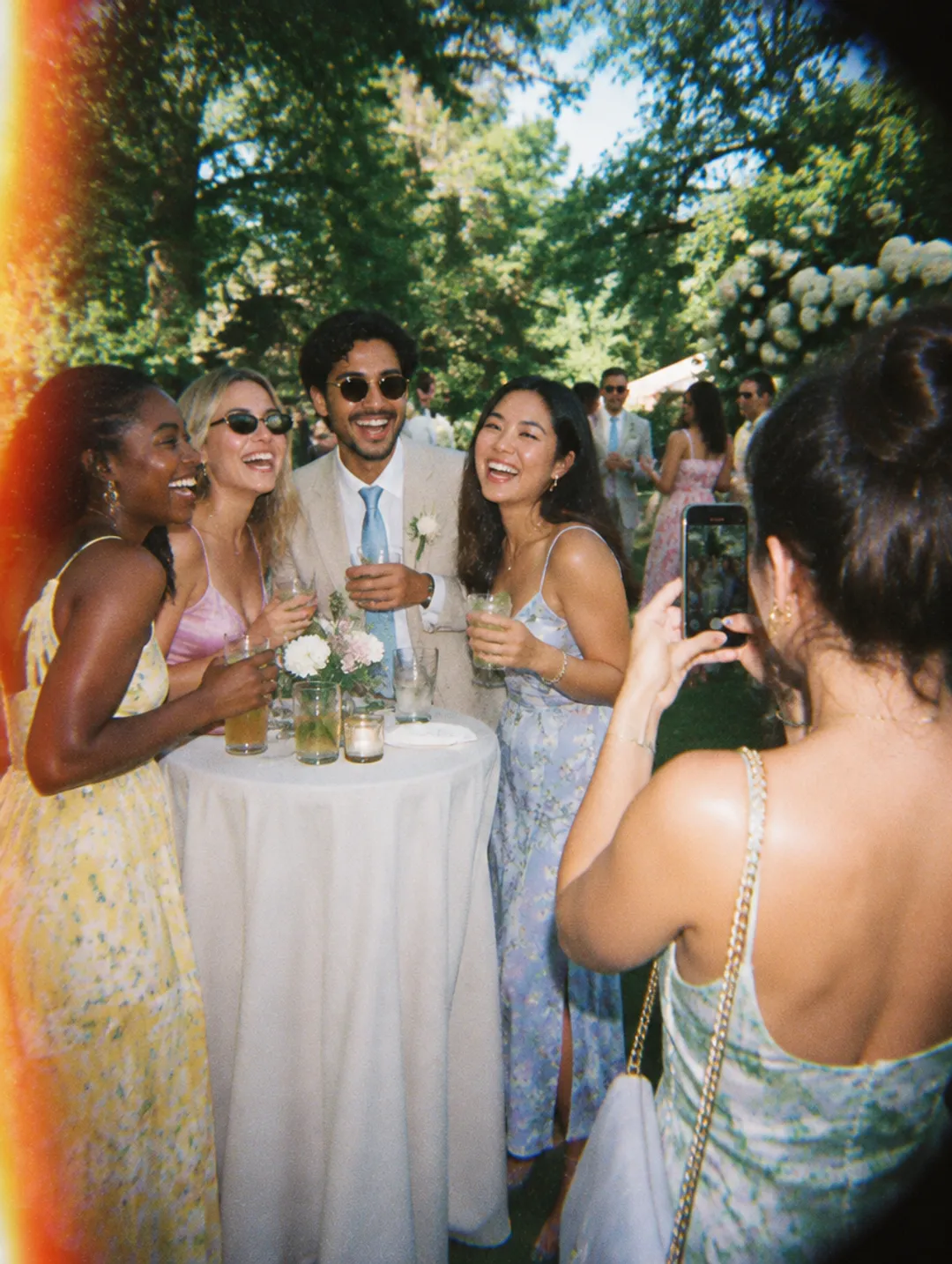 Guests at a garden cocktail hour